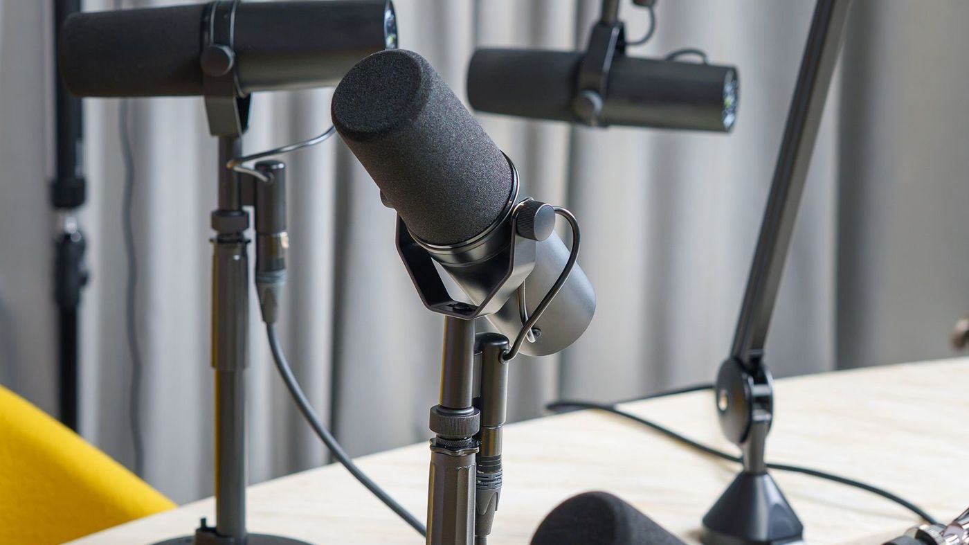 Professional podcast studio with condenser microphones on stands
