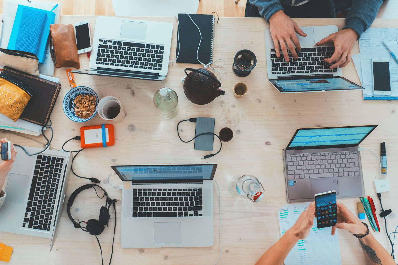 People using phones and devices, like customers tapping a landing page