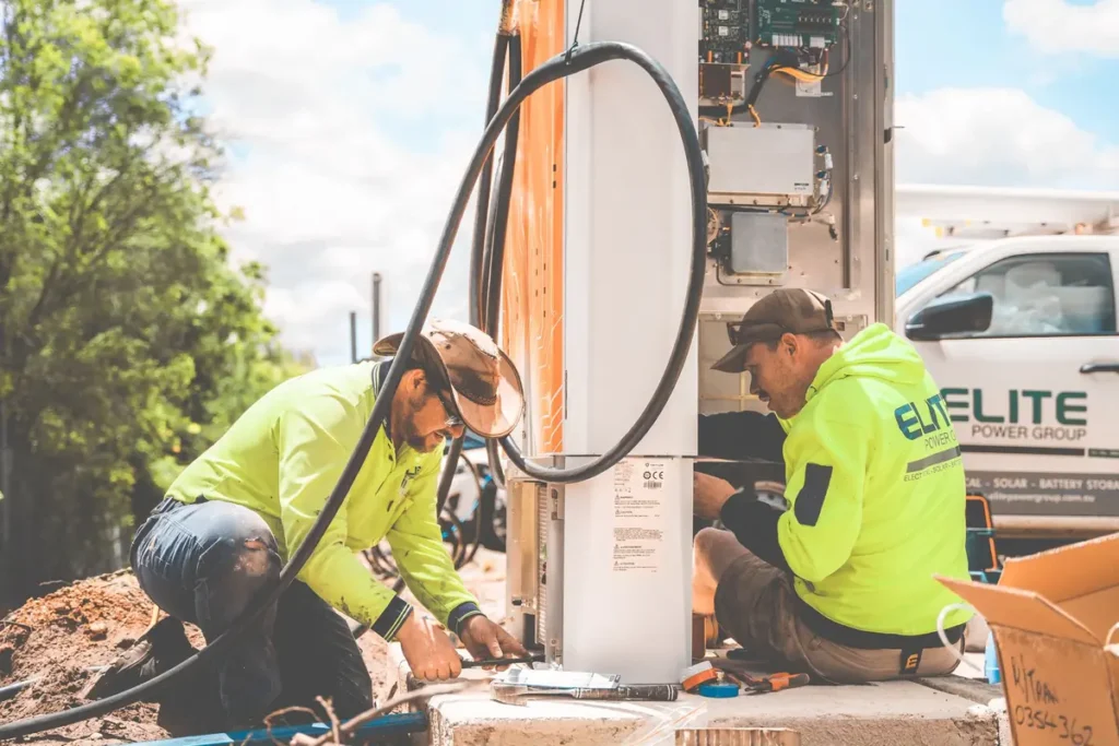 Service crew working beside their company truck